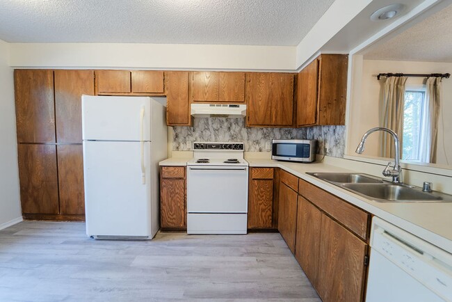 Photo - This darling 2 bedroom, 1.5 bath townhome is perfect for low maintenance, one level living! With ...