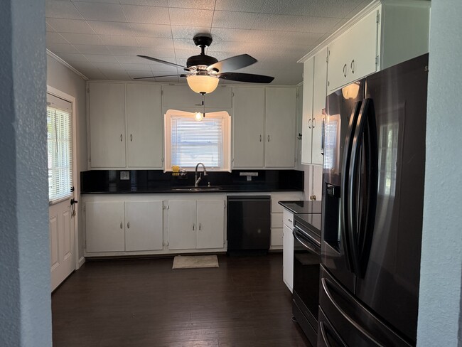 Kitchen with all appliances including dishwasher and microwave