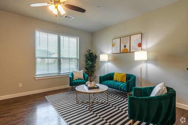4BR, 2.5BA - 1,897SF - Living Room - Townhomes at Bluebonnet Trails
