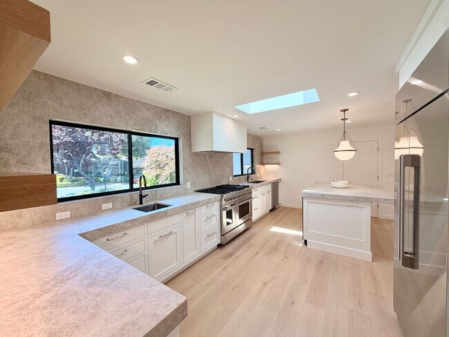 Photo - This premier 4-bed, 3-bath estate spans 2,565 sq. ft. on a 10,253 sq. ft. lot in North Los Altos.
