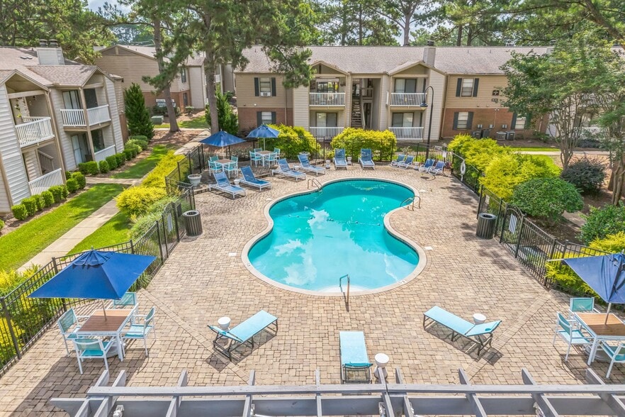 Relax poolside with comfortable lounge chairs and shaded umbrellas at our resort-style swimming pool, professionally operated by Highlands Vista Group.