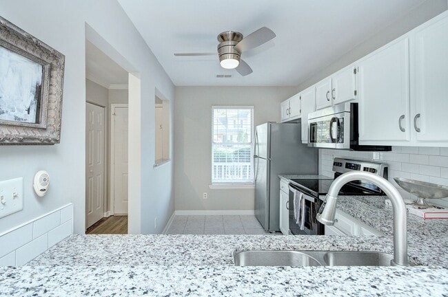 Photo - Discover this beautifully updated Raintree townhome featuring an open floor plan and a range of c...