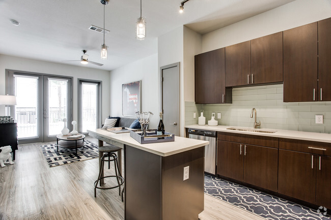 Modern kitchens feature quartz countertops and Whirlpool stainless steel appliances - Windsor West Lemmon Rental