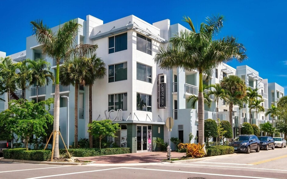 Palm-Lined Corner Entrance to South of Atlantic Luxury Apartments