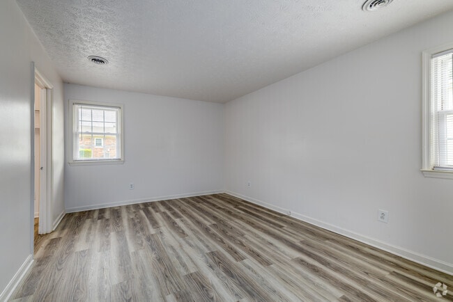 2BR, 1.5BA - 1,100SF - Primary Bedroom - Highlander Apartments