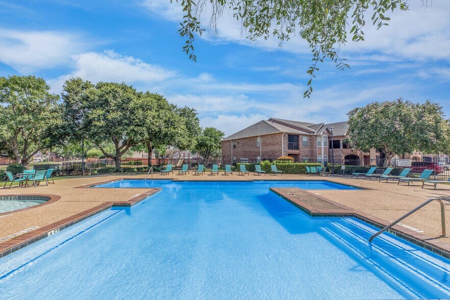 SHIMMERING SWIMMING POOL AT WATERFORD AT VALLEY RANCH IN IRVING, TX