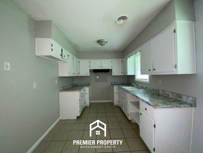 Photo - Spacious 4BR Family Home in Raleigh | Modern Tile Floors & Spacious Backyard