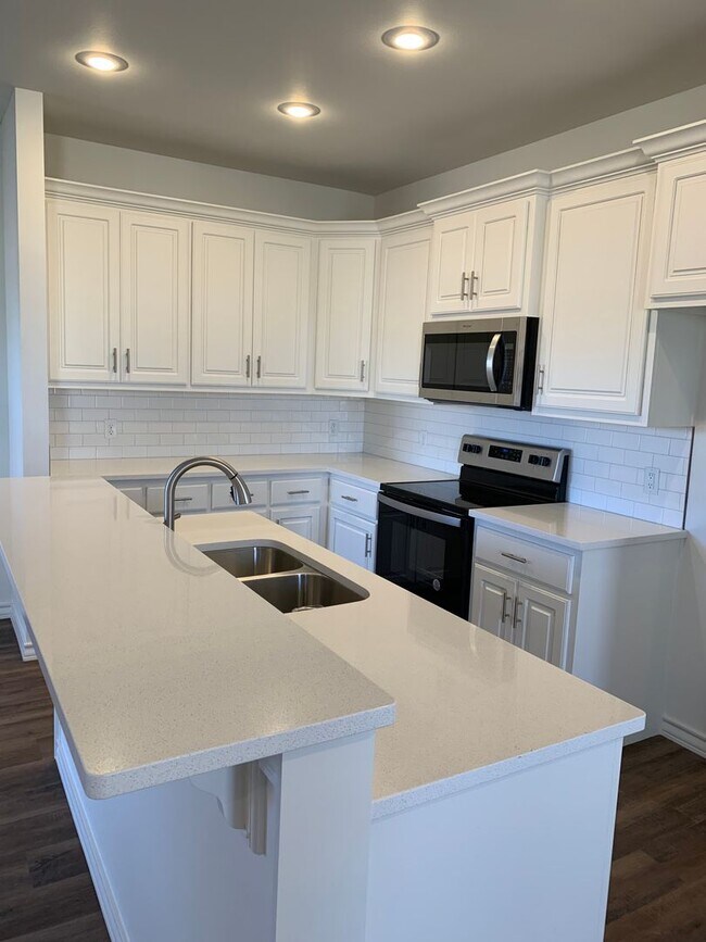 Photo - Brand new open concept quartz countertops Unit A
