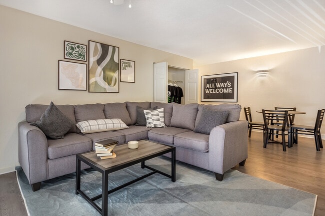 Experience modern comfort in this beautifully designed living room and dining space.