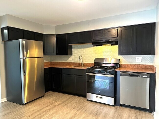 Building Photo - 8656 84th Ct Unit Apt 1NW
