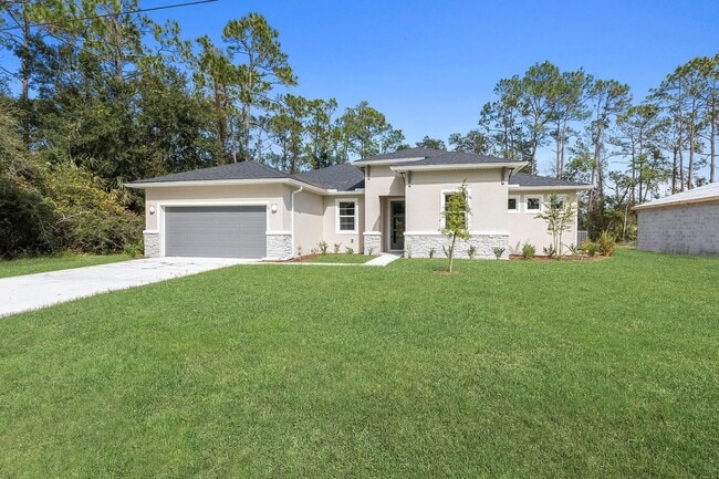 Building Photo - Spacious 4-Bedroom Rental in Palm Coast with Ultimate Privacy