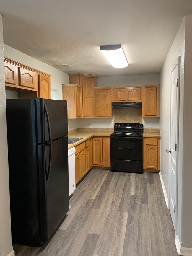 Photo - Super cute and updated with fresh paint, new floors, some fixtures, and all appliances.