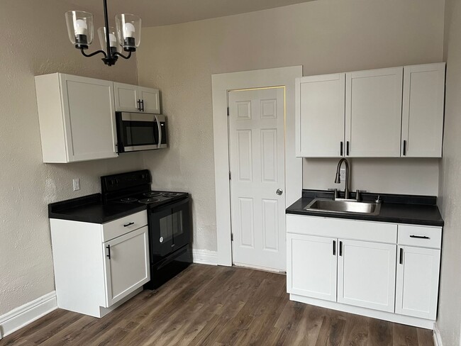 Photo - DOWNTOWN…. Utilities included Unit Apt. C