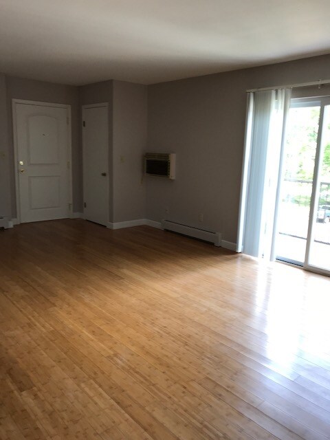 Living Room with Balcony - 7076 New Yorker Ave Unit 5