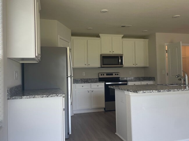Photo - Spacious 3-bedroom with a massive Owner's Retreat and Dual Closets.