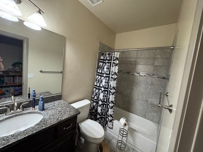 Photo - 6 Bed/4 Bath Home with Walkout Basement and Extra Storage! Fully Fenced!