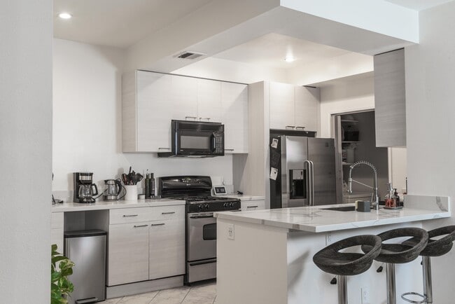 Kitchen, stainless appliances and washer/dryer pantry - 10021 Tabor Street Unit Apt 107