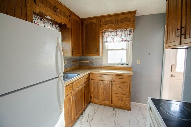 Photo - Fenced Yard, 2-Car Garage + Quiet Location!