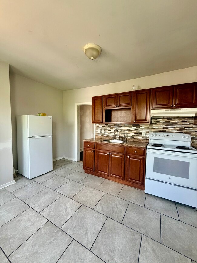 Building Photo - 5764 Osage Ave Unit 2