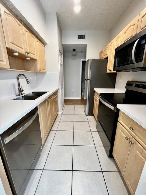 Building Photo - 7085 Nova Dr Unit 311