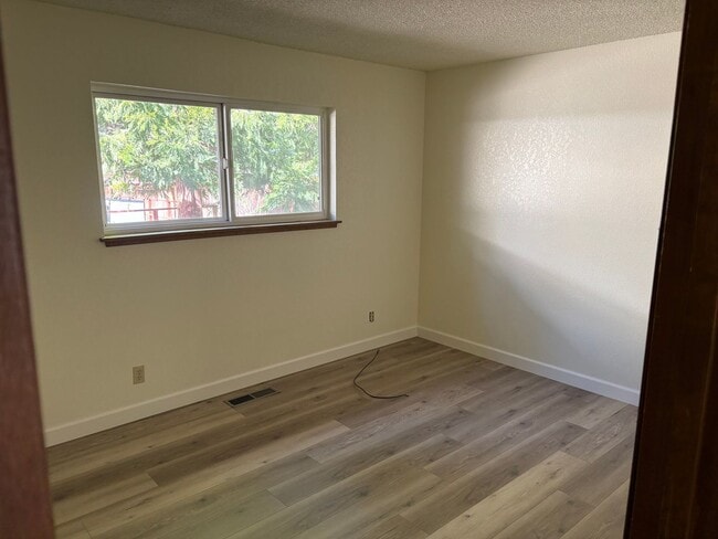 Photo - One level cabin with fenced backyard and garage