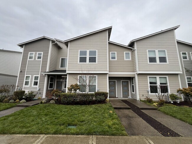 Photo - Stylish Two-Story Living with Fireplace, Island Kitchen & Private Primary Suite