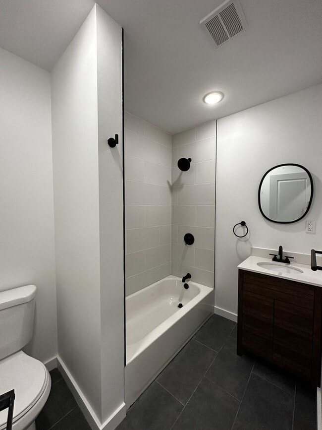 Photo - Renovated 2BR/2BA w/ Private Yard, Porch & In-Unit Laundry Unit 1F