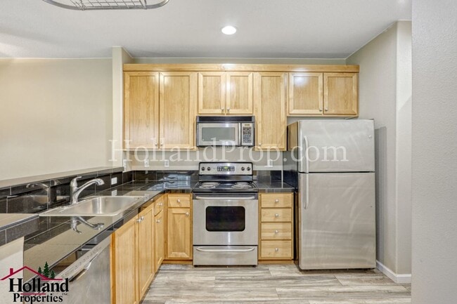 Photo - Elegant One-Bedroom Condo with Natural Light & Prime Location
