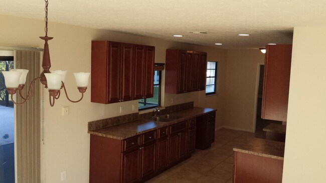 Photo - 3/2/1 with screened in patio/pool