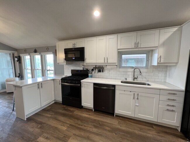 Kitchen with Dishwasher and modern appliances - 19126 Edgewater Rd NE House