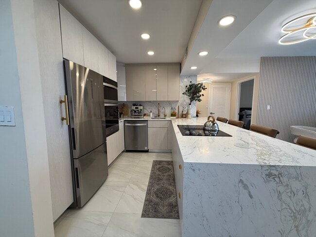 Fully equipped kitchen - 500 Three Islands Blvd Unit 214A