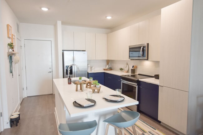 Chef-inspired kitchen with undermount sink, pull-down faucet, and plenty of pantry space
