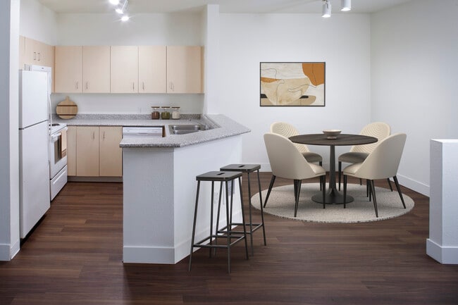 Kitchen and dining room with hard surface flooring (select homes) - eaves RockMeadow