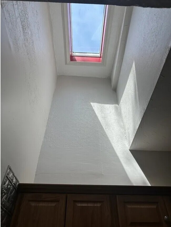 Skylight thru High vaulted ceiling - 65 Manchester St Unit STAY A WHILE