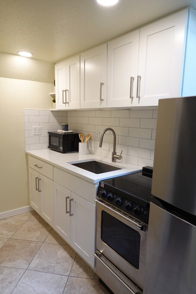 Renovated kitchen with new appliances - 525 NE 86th St Unit C