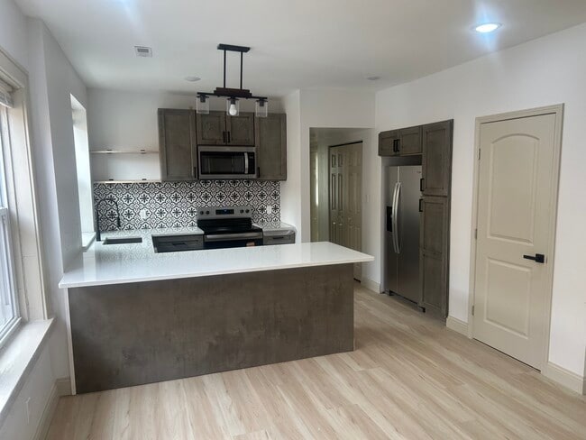 Building Photo - 7232 Wise Ave Unit 1