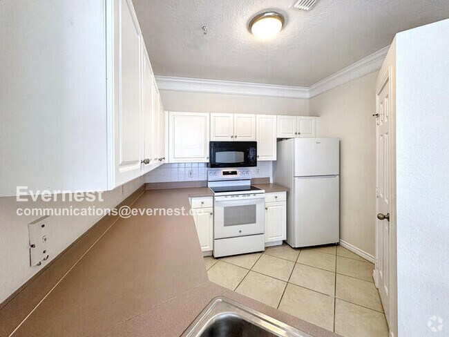 Building Photo - Lovely 2BR Third-Floor Condo in Gated Comm... Unit APT 303