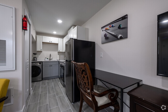 1BR, 1BA - 600SF - Kitchen and Dining Area - Beachside Palms @ Daytona Beach