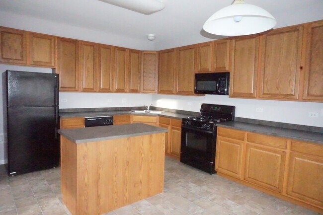 Photo - Rare find-3 Bedroom spacious corner unit with Den, 2.5 baths and 2 car garage