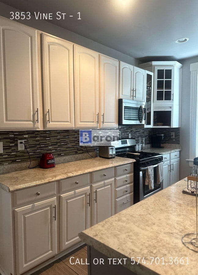 Building Photo - 3853 Vine St Unit 1