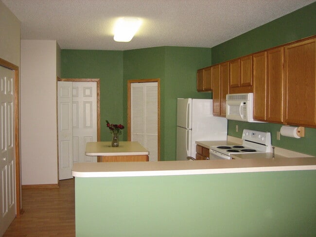kitchen, half bath and utility - 15100 Dunwood Trl