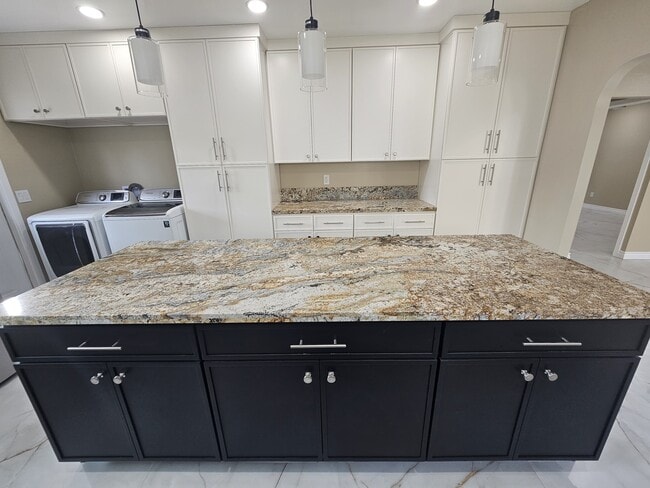 Lots of counter space, washer and dryer, 2 large pantry storage with pull out drawers! - 918 E Elk Ave