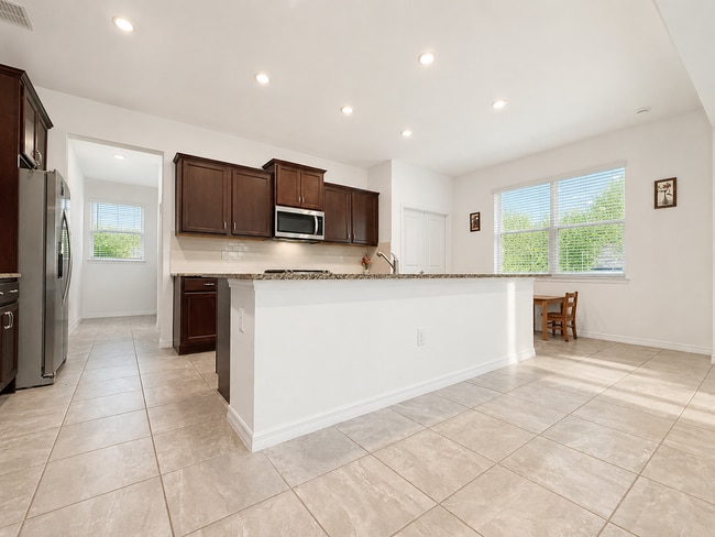 Photo - Experience modern & expansive living in this corner-lot 5Bedrooms/3.5Bath home at Ocala!