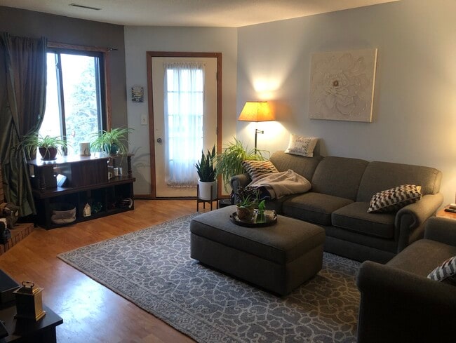 Living room with door to private deck - 2050 Holiday Rd Unit # C4