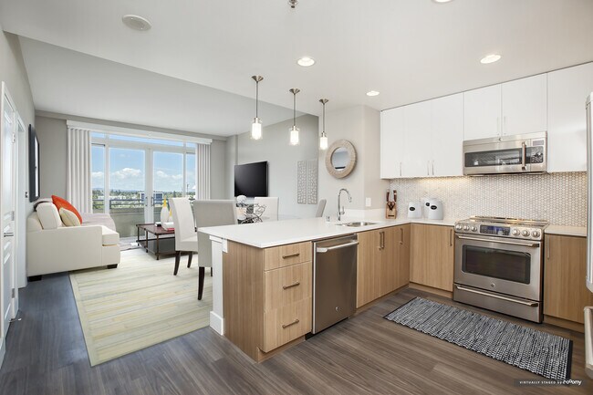 Signature Collection Kitchen Living and Dining Area with Hard Surface Vinyl Plank Flooring