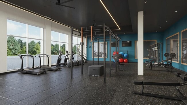 Club-quality fitness studio with spin bikes and personal workout pods at Modera Shoreline in Shoreline, WA. - Modera Shoreline