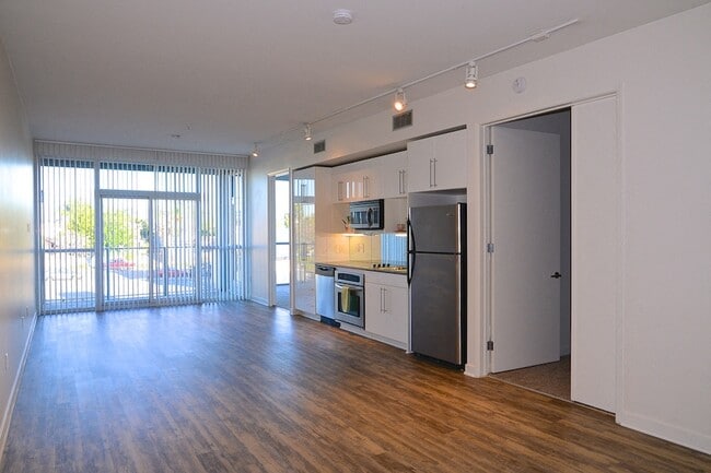 Large living room with open kitchen at 12th Street Lofts in National City, California.