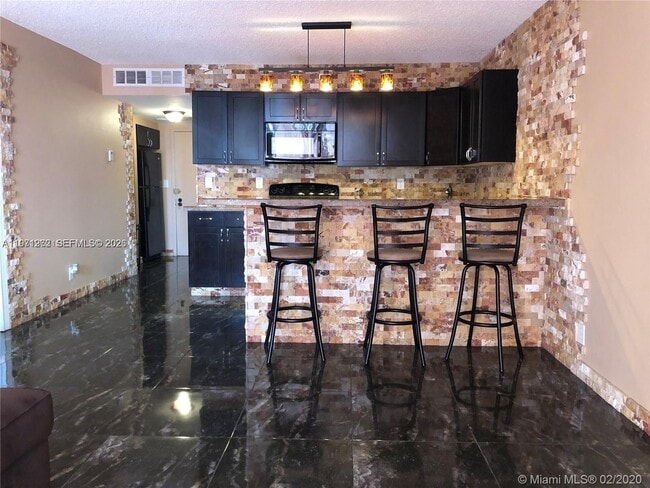 Photo - 600 Three Islands Boulevard Unidad 1018