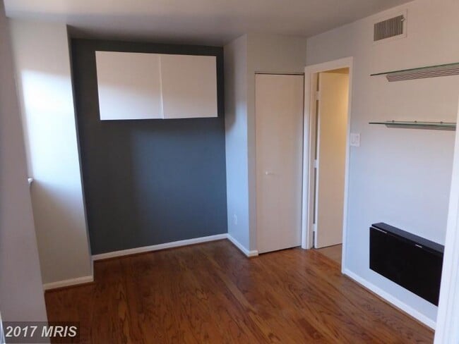 Bedroom with attached bathroom. - 1436 Meridian Pl NW Unit 404