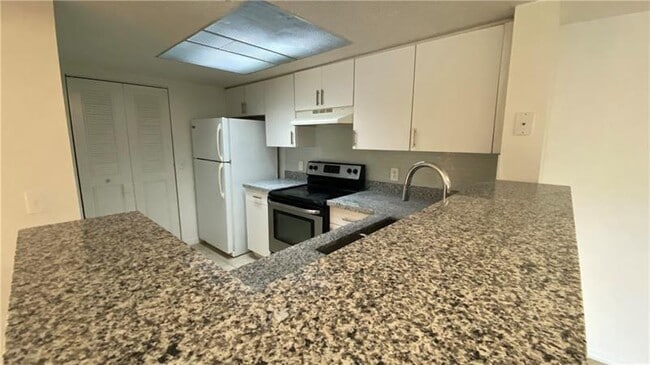 Building Photo - 5045 Wiles Rd Unit 205 Rental